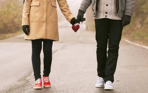 Couple holding hands on Valentine's Day