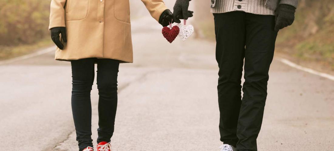 Couple holding hands on Valentine's Day